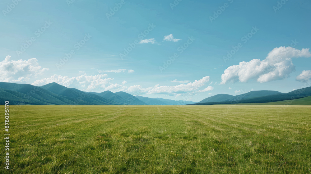 Fototapeta premium The image shows a beautiful landscape with green fields and mountains in the distance.