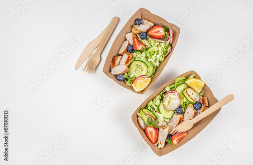 Healthy food in disposable eco friendly food packaging. Street food festival, catering service photo