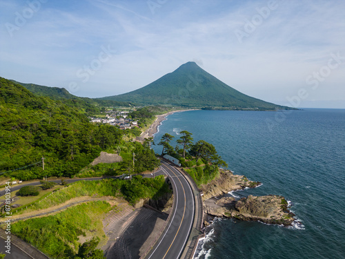 Kagoshima, Japan: Aerial drone view of the stunning coastal road of Kyushu with the Kaimon volcano by the sea in Japan.