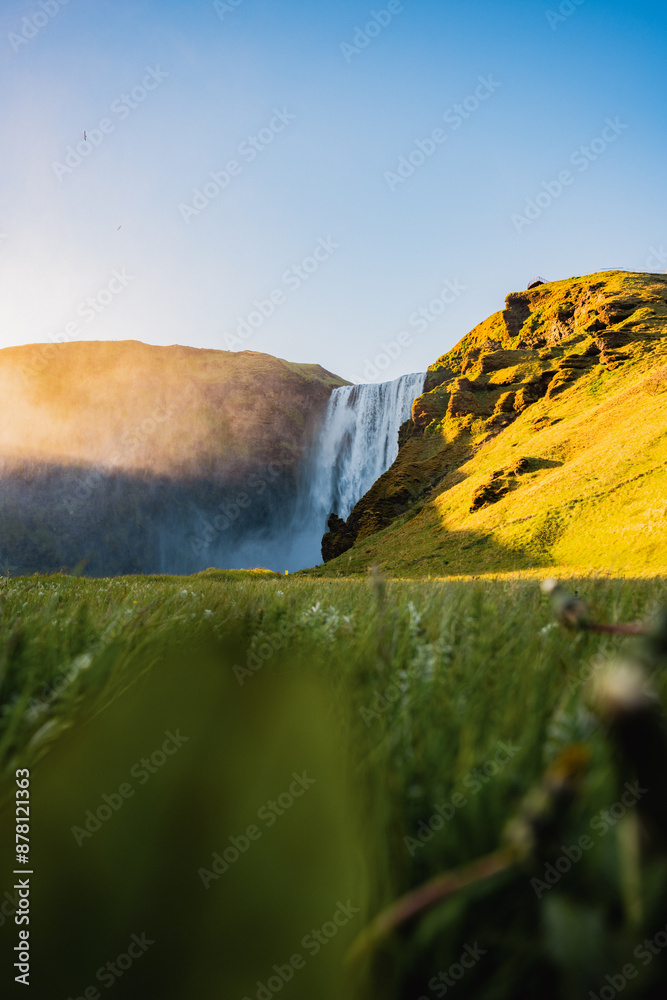 Stunning view of the Skógafoss Waterfall at sunset. Skógafoss is one of the biggest waterfalls in Iceland, situated on the Skoga River in the south of Iceland.