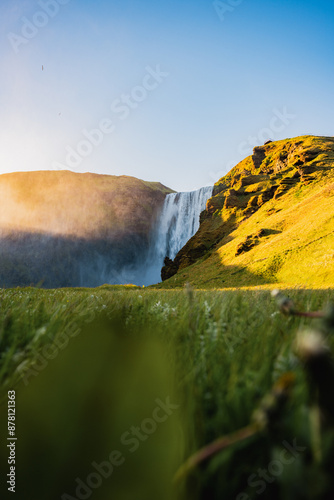 Obraz na płótnie Stunning view of the Skógafoss Waterfall at sunset. Skógafoss is one of the biggest waterfalls in Iceland, situated on the Skoga River in the south of Iceland. w salonie