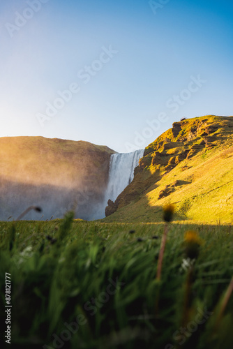 Obraz na płótnie Stunning view of the Skógafoss Waterfall at sunset. Skógafoss is one of the biggest waterfalls in Iceland, situated on the Skoga River in the south of Iceland. w salonie