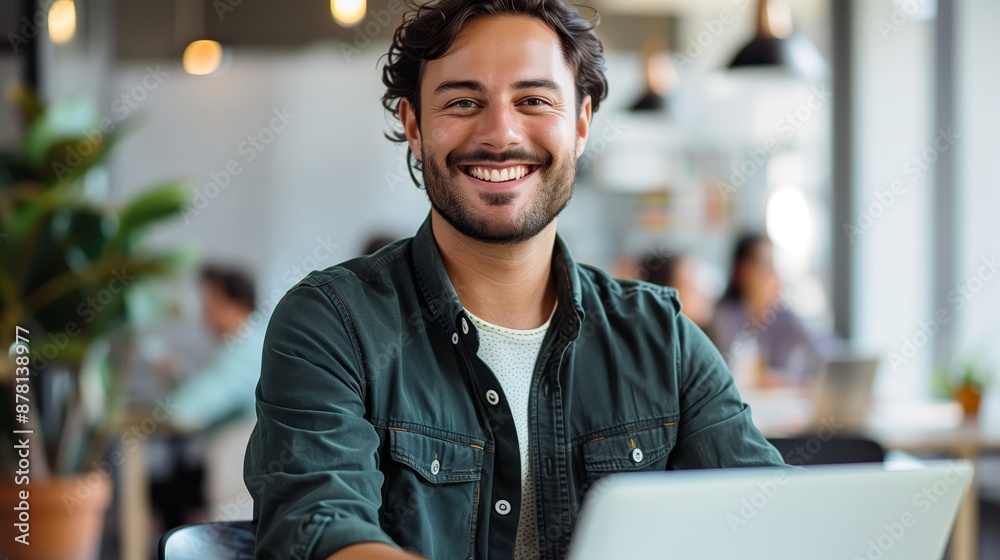 Happy middle aged business man ceo sitting at desk using laptop in office and smiling to camera Happy middle aged business man ceo sitting at desk using laptop in office and smiling to camera