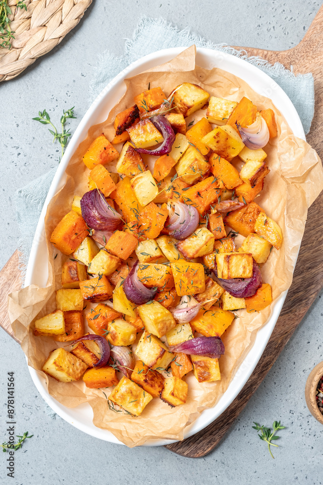 A white plate of vegetables with onions and herbs on top A white plate of vegetables with onions and herbs on top