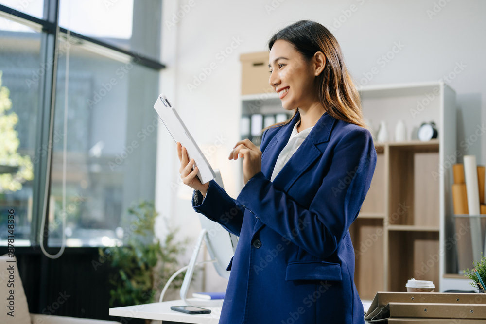 Confident business expert attractive smiling young woman holding digital tablet on desk in creative Confident business expert attractive smiling young woman holding digital tablet on desk in creative