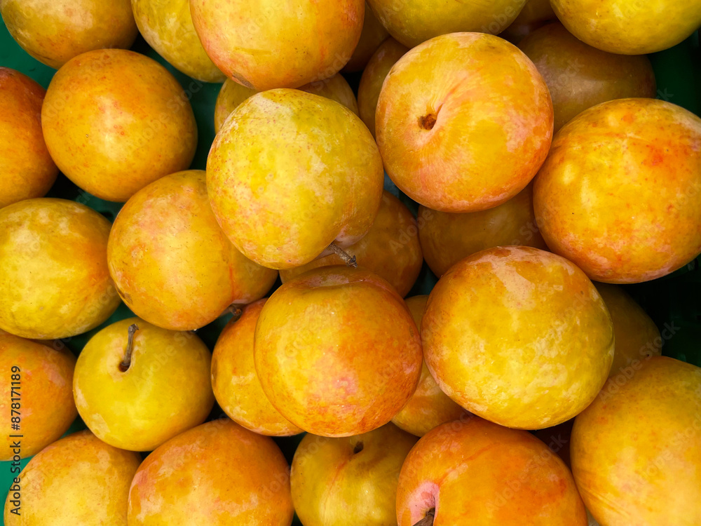 Yellow plums close up as a background at a Greek market. Healthy and tasty food. Biological product. Yellow plums close up as a background at a Greek market. Healthy and tasty food. Biological product.