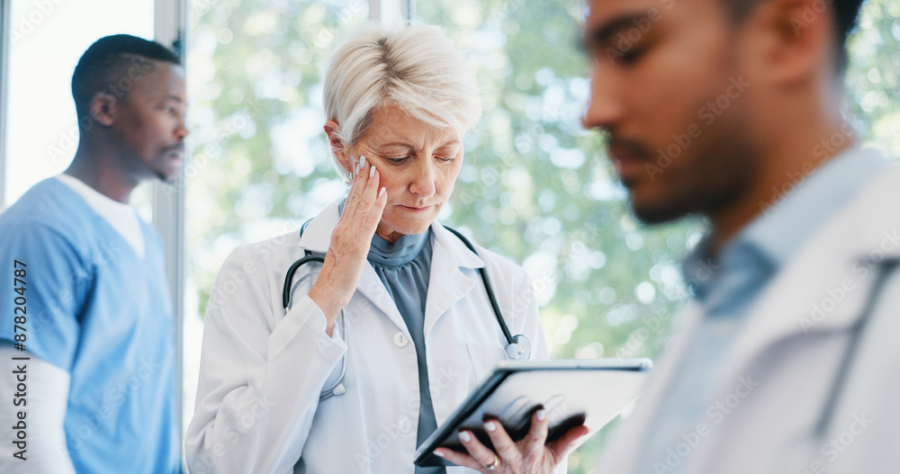 Fototapeta premium Senior woman, doctor and headache in burnout, grief or mistake with digital report in hospital building. Frustrated physician, medical healthcare and person in stress, loss or fatigue at clinic