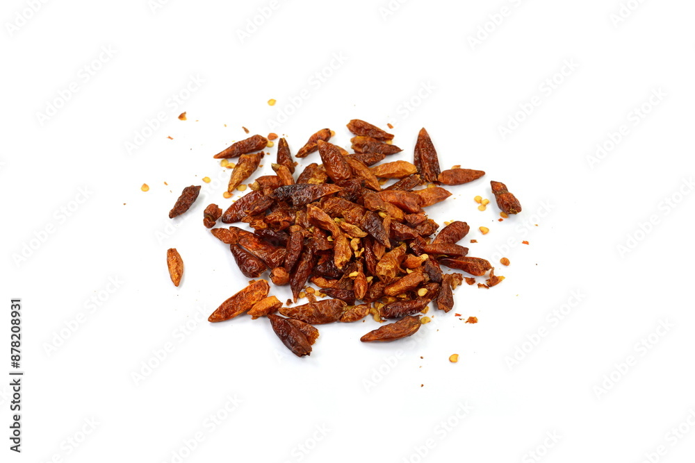Fototapeta premium Red chilli flakes, Hot crushed red cayenne pepper flakes scattered over white background.dried chili flakes and seeds 