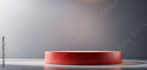 Red round pedestal for product display in white room