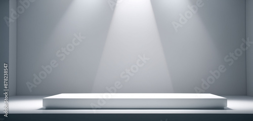 A product display pedestal illuminated by studio light in a white room