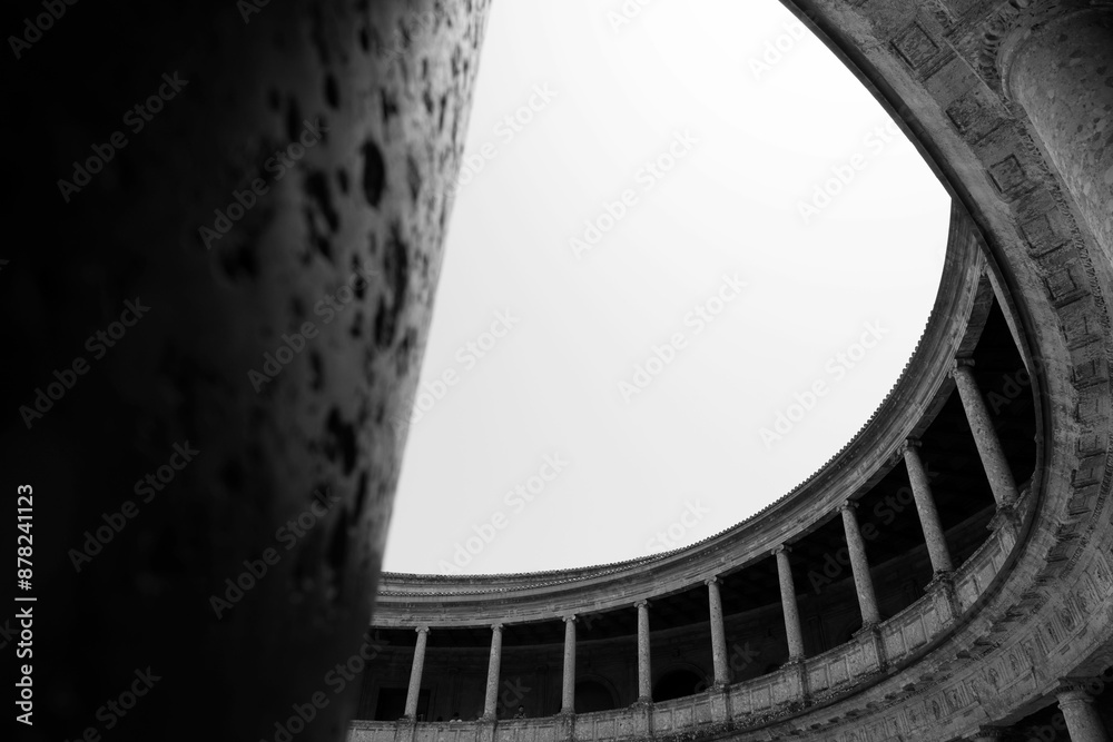 Fototapeta premium Black and white architectural detail of a circular colonnade with a clear sky