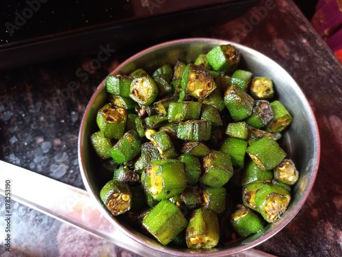 Hybrid Bhindi Seeds,Hybrid Bhindi Seeds,Dry Lady finger seeds okra,Small cutting okra frying pieces in Steel Plate  photo