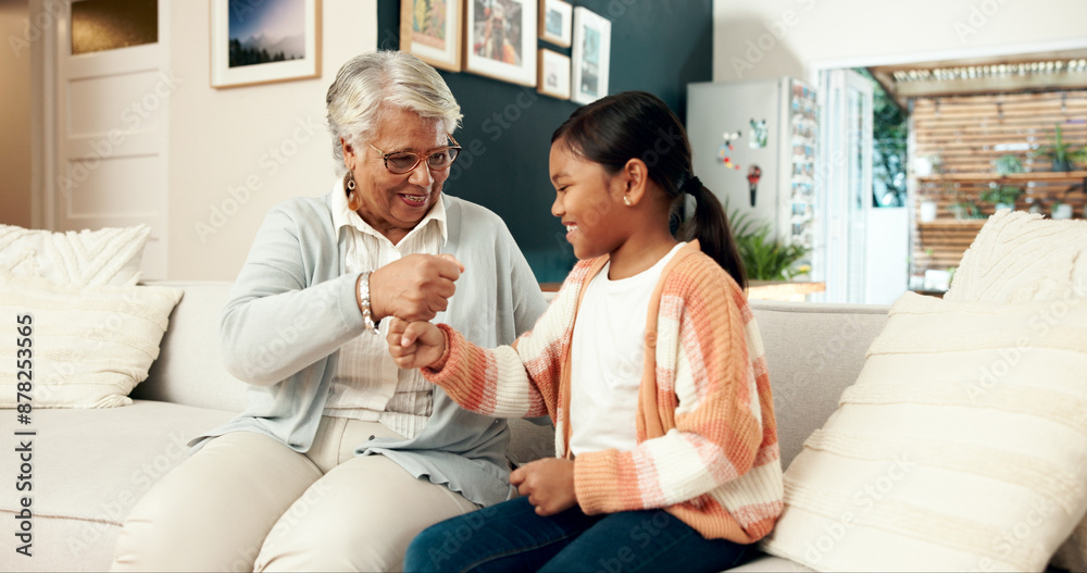 Fototapeta premium Hands, fist and stack with child, family in house for playful and fun happiness, bonding together and relax. Granny, home and girl with handshake, game and cheerful with smile, positive and break