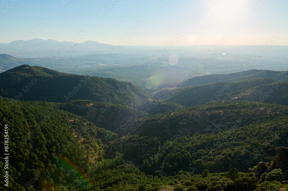 Scenic view of mountain range and valleys under clear blue sky Scenic view of mountain range and valleys under clear blue sky