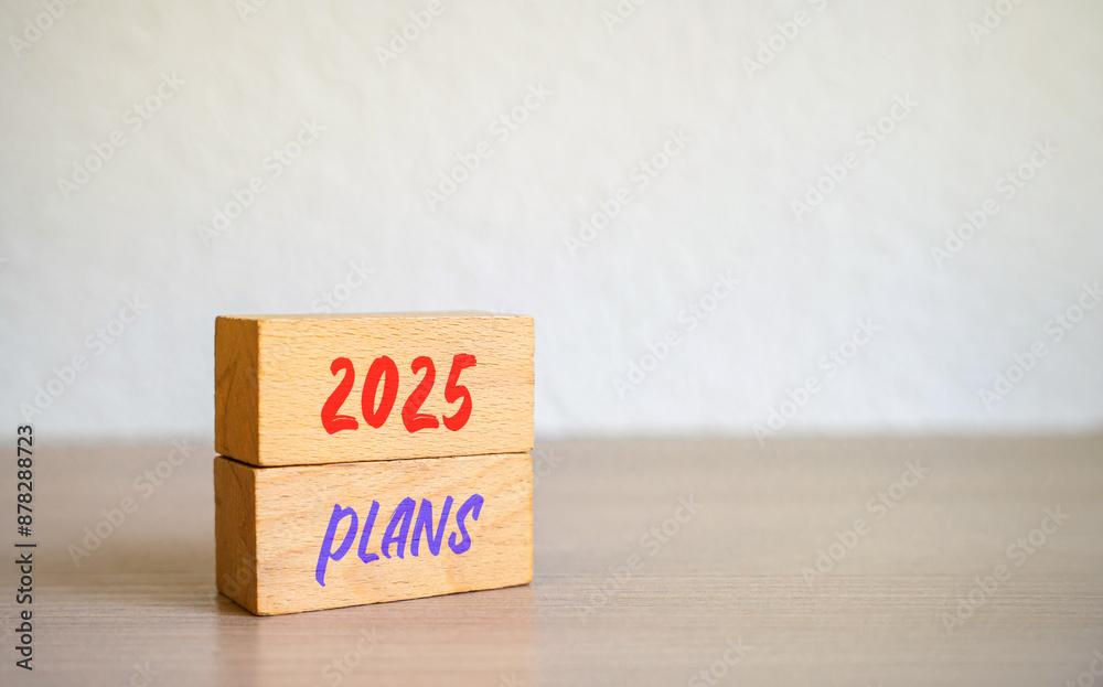2025 plans in wooden blocks. Setting goal, target for next year. Plan and tasks. Financial management in company. Business and finance concept