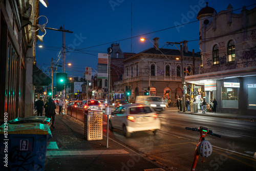 johnston street in melbourne at night on with night life in australia in summer photo