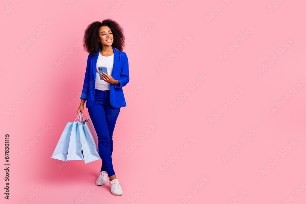Photo of glamour charming girl wear trendy blue clothes look empty space isolated on pink color background Photo of glamour charming girl wear trendy blue clothes look empty space isolated on pink color background