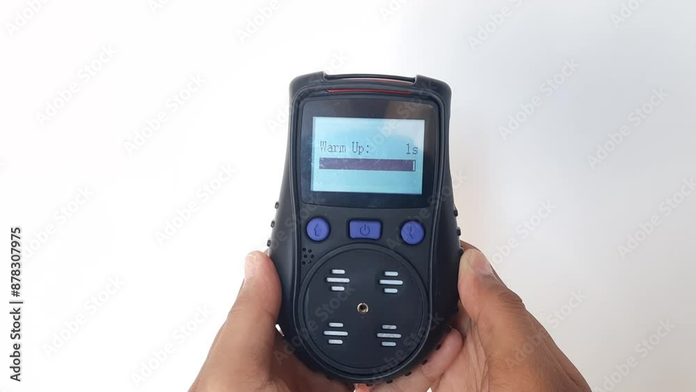 Using a portable gas detector to monitor the composition of the surrounding air or toxic gases (on a white background). Industrial action. Using a portable gas detector to monitor the composition of the surrounding air or toxic gases (on a white background). Industrial action.