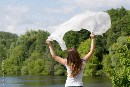 Young woman with white cloth, concept of ease