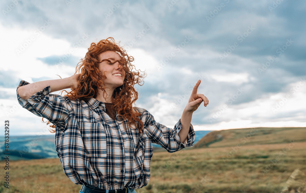 Young Woman With Red Hair Enjoying View From Hilltop Young Woman With Red Hair Enjoying View From Hilltop