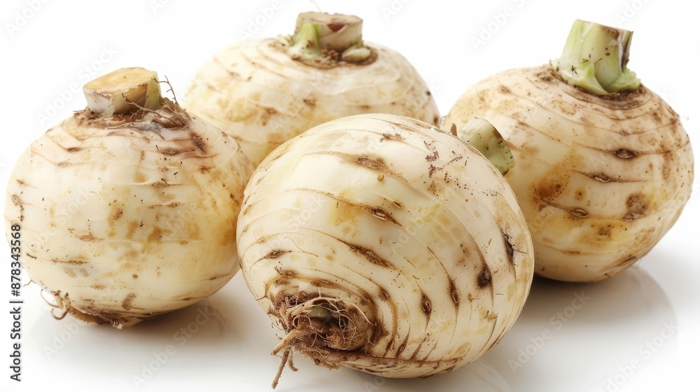 A photo of organic Jerusalem artichoke tubers, also known as sunchoke or sunroot, isolated on a white background. A photo of organic Jerusalem artichoke tubers, also known as sunchoke or sunroot, isolated on a white background.