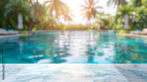 Empty white marble stone table top and blurred swimming pool in tropical resort in summer banner background 