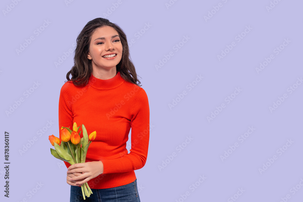Young Woman in Red Sweater Holds Tulips and Smiles Against Light Purple Background Young Woman in Red Sweater Holds Tulips and Smiles Against Light Purple Background