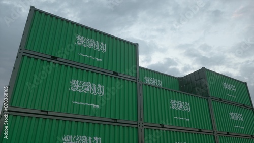 Saudi Arabia flag containers are located at the container terminal. Saudi Arabia export or import concept. 3d illustration