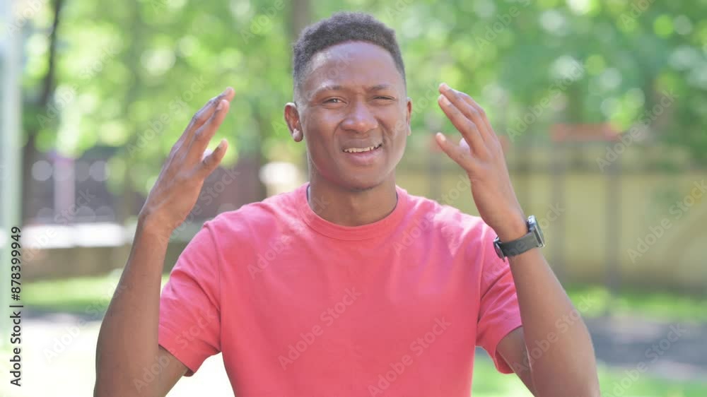 Casual African Man Reacting to Failure while Standing Outdoor Casual African Man Reacting to Failure while Standing Outdoor