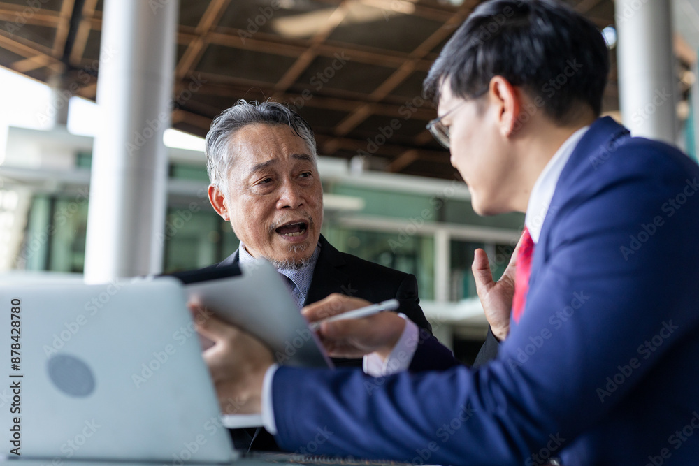 Asian multi generation business men wear suit working together. Senior and young businessman discussing agreements to meetings with partners and connections. Discuss business strategy. Asian multi generation business men wear suit working together. Senior and young businessman discussing agreements to meetings with partners and connections. Discuss business strategy.