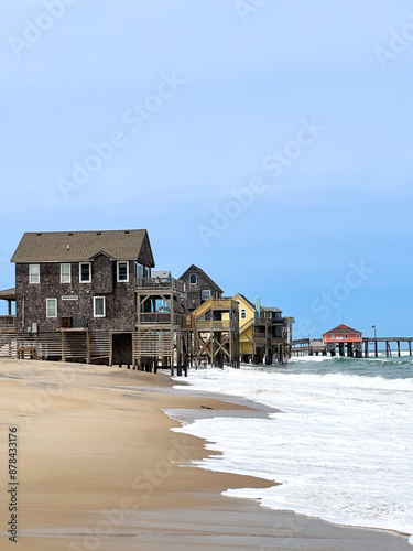 Beach houses at the water's edge in a coastal ocean landscape in the Outer Banks photo