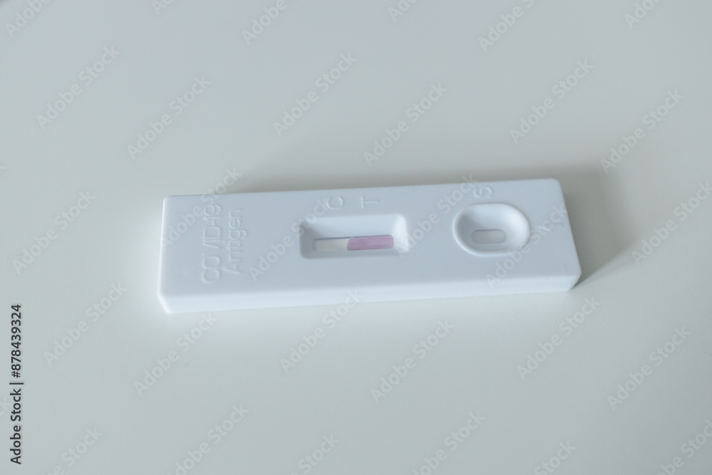 Caucasian woman using rapid antigen test kit for self test COVID-19 epidemic at home. Adult female unpacking a swab for inserts into her nose. COVID-19 coronavirus pandemic protection concept. Caucasian woman using rapid antigen test kit for self test COVID-19 epidemic at home. Adult female unpacking a swab for inserts into her nose. COVID-19 coronavirus pandemic protection concept.