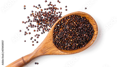 red quinoa seeds in wooden spoon isolated on white background. Top view photo