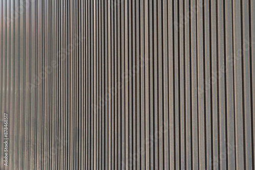 Wall metal sheet texture background for modern design. Silver aluminum shiny for roof warehouse. Texture of corrugated sheet metal facade. Panorama of black metal texture surface galvanized steel