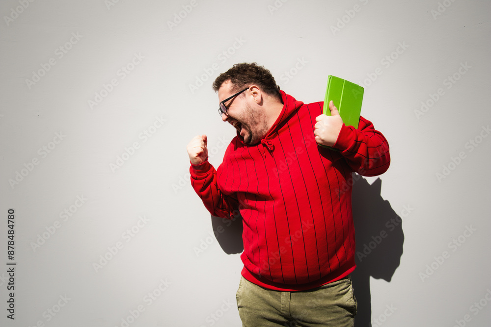 Funny man is engaged in online shopping.
