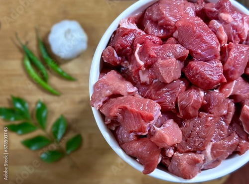 Fresh beef in a bowl on blurred background  photo