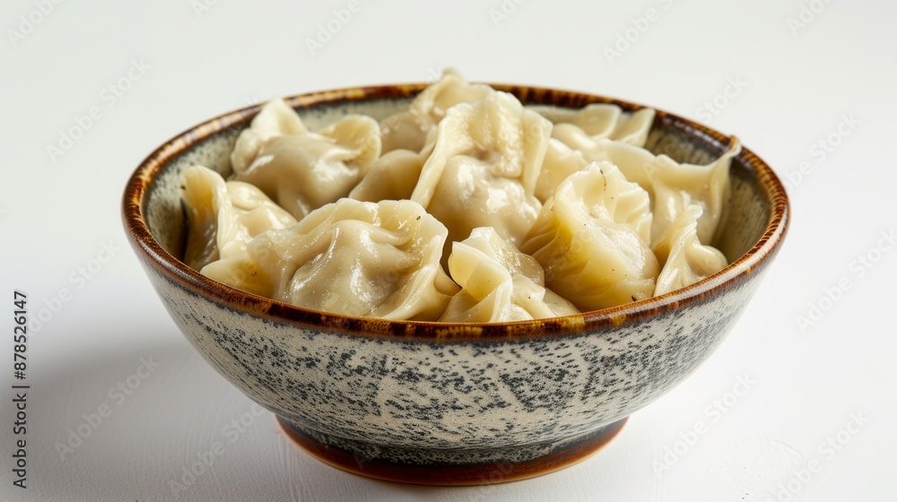 Dumplings in a bowl on a white background
