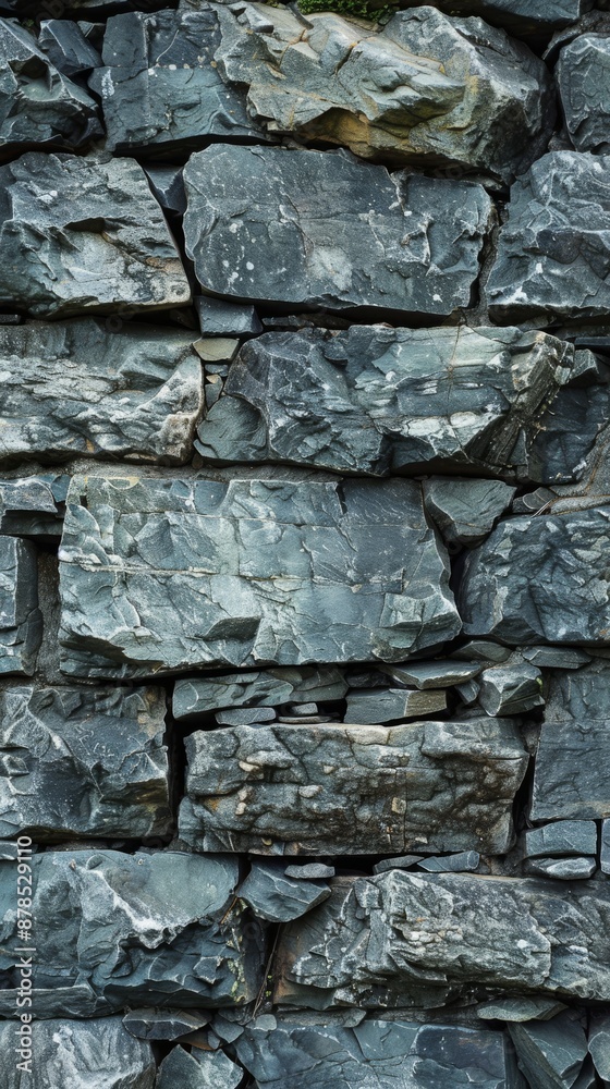 Background image featuring a rough stone wall, creating a rugged and natural aesthetic. The image highlights the intricate details and textures of the stones Background image featuring a rough stone wall, creating a rugged and natural aesthetic. The image highlights the intricate details and textures of the stones