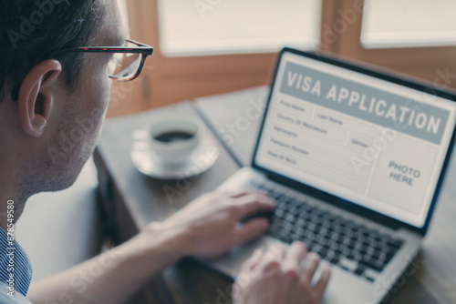 Online visa application, man filling form for immigration or tourism visa request for foreign country.