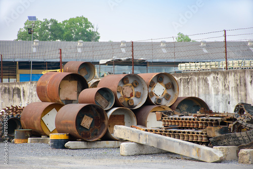 Industrial scrap metal that rusts is automotive industry parts and metal parts of large machines. Pile of various rusted industrial steel equipment on the floor in an factory 2025.