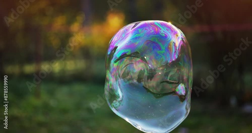 Colorful soap bubble flying, happiness and playful mood concept, slow motion 4k footage