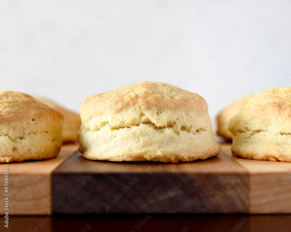 Homemade Biscuits on Wooden Surface With White Background Homemade Biscuits on Wooden Surface With White Background