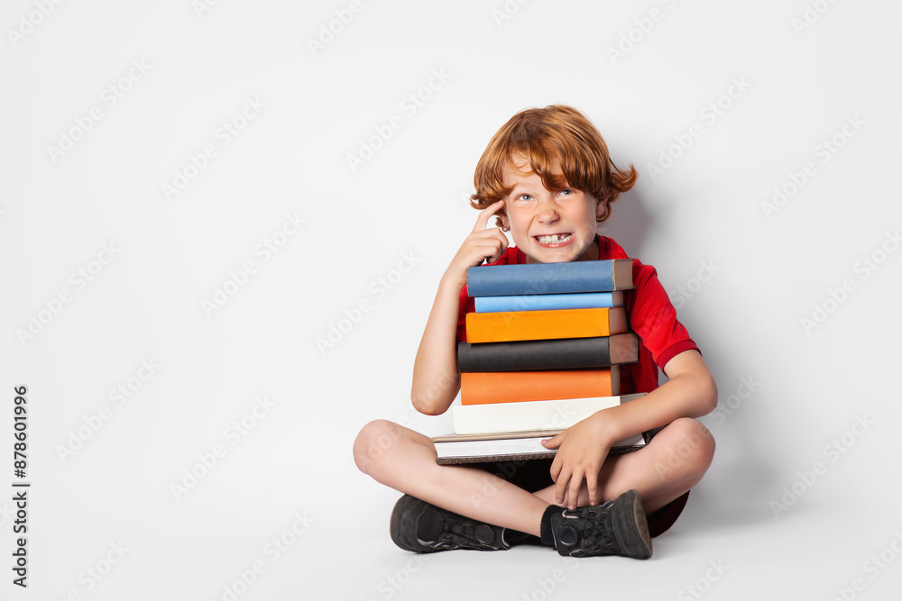 Preschooler with books ready for school. Cunning, funny boy on thinking. Preschooler with books ready for school. Cunning, funny boy on thinking.