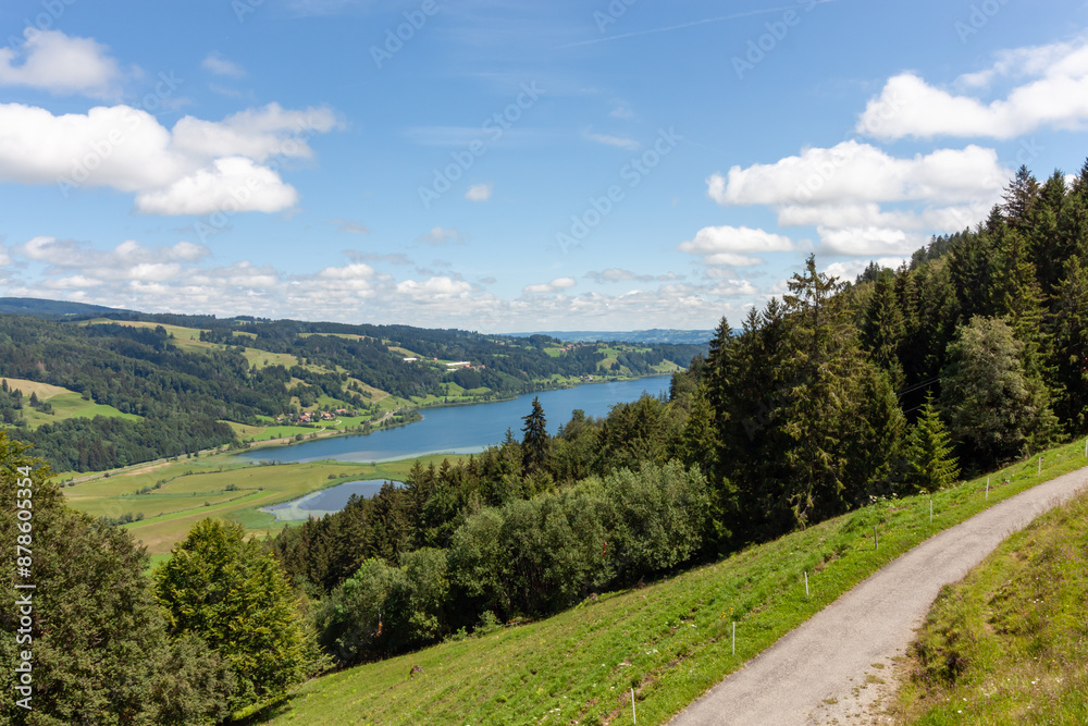 Mountain landscape, view from the chairlift. Below is the Alpsee Mountain landscape, view from the chairlift. Below is the Alpsee