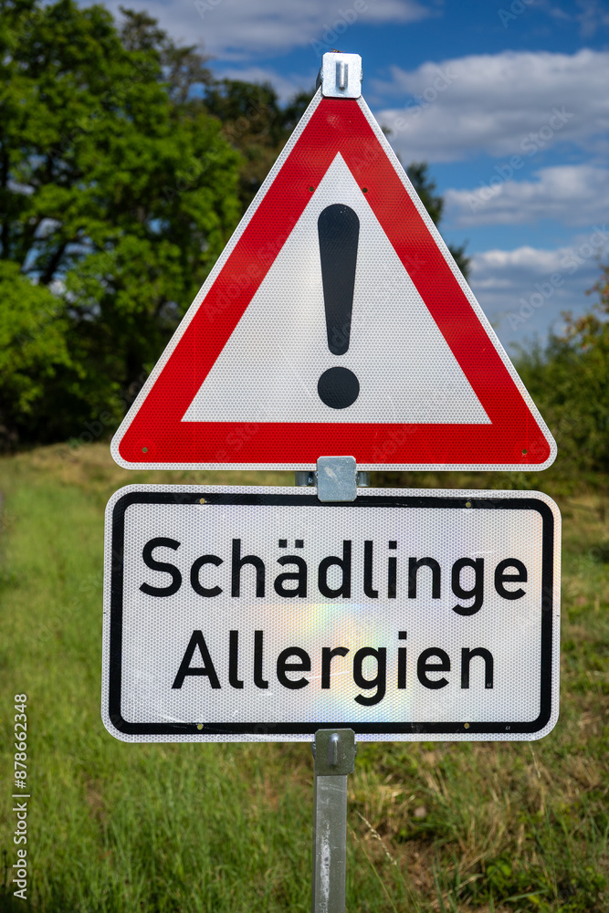 street sign in natural background with warning text street sign in natural background with warning text