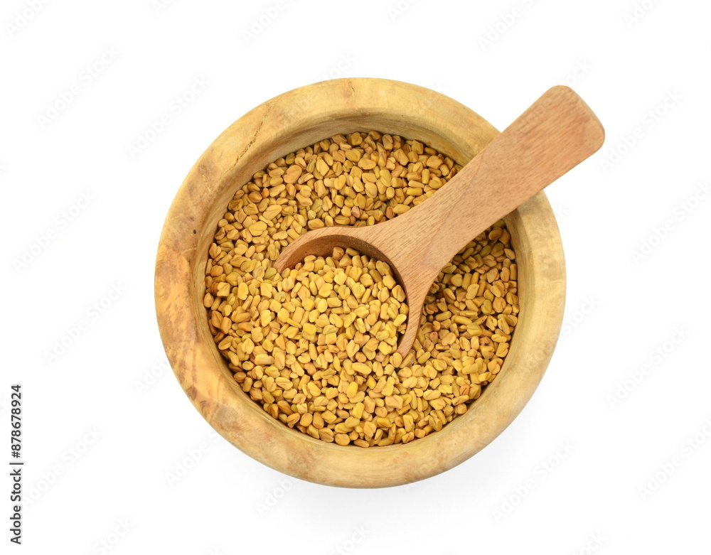 Fenugreek seeds in a wooden bowl with spoon isolated on white background Fenugreek seeds in a wooden bowl with spoon isolated on white background