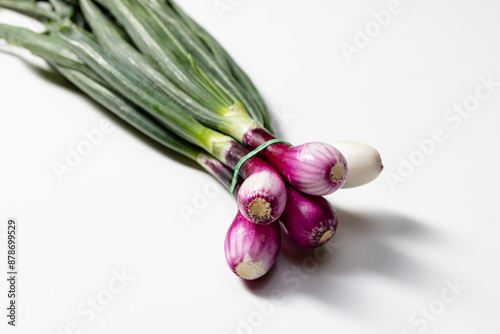 bunch of fresh red onions with purple and white bulbs