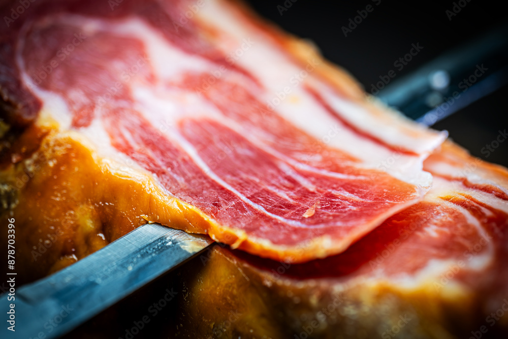 Chef cutting dry-cured spanish ham Jamon. Chef cutting dry-cured spanish ham Jamon.
