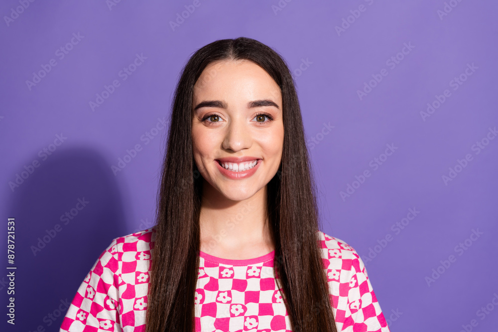 Fototapeta premium Photo of pretty young woman beaming smile empty space wear checkered t-shirt isolated on purple color background