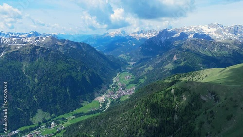 Italy dolomites natural park sella pass surroundings mountainsa and clouds 4k video with drone photo